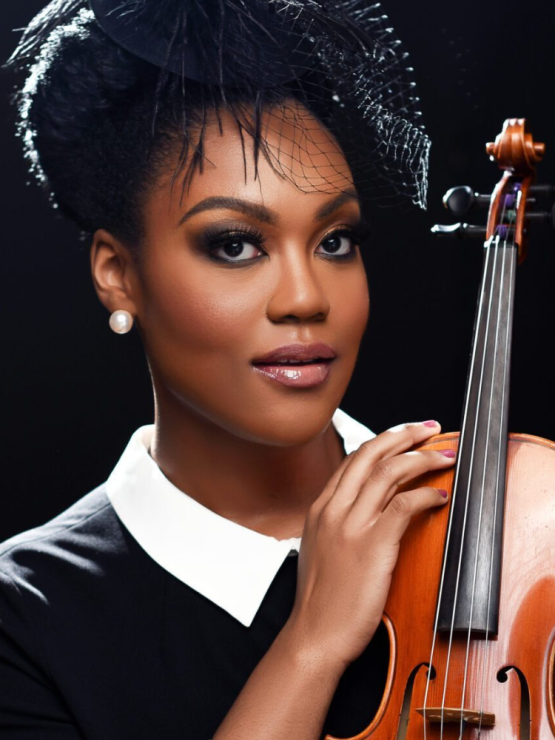 a luminous black woman, wearing a black dress with a white collar and a small black hat with a net veil, holds her violin to her shoulder