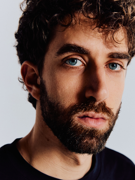 guitarist ely perlman, portrait with electric and acoustic instruments