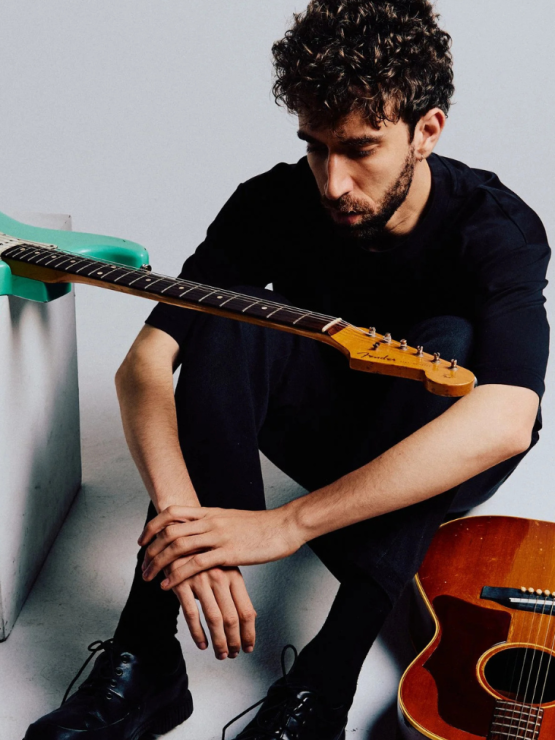 guitarist ely perlman, portrait with electric and acoustic instruments