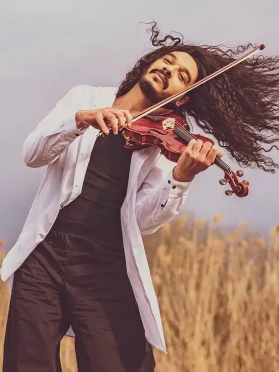 violinist Nemanja Radulovic, outdoor portrait with violin