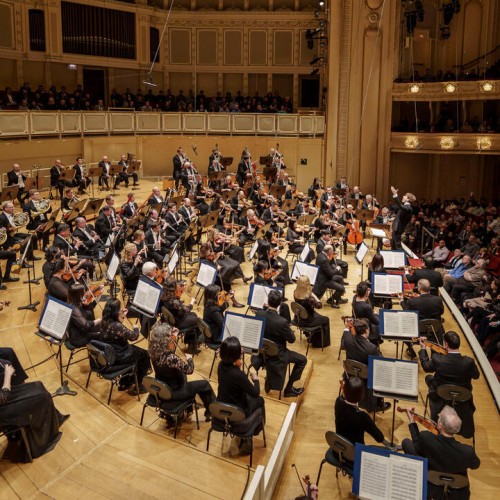 from the side of the stage, the chicago symphony orchestra performs in  Orchestra Hall