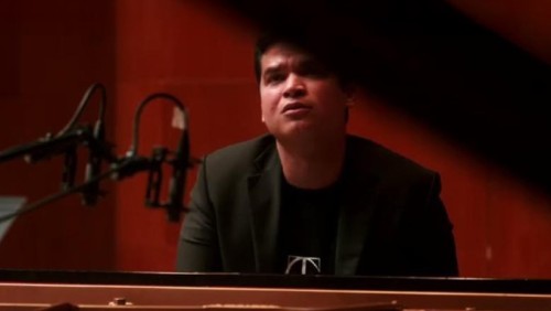 pianist Ahmed Alom, portrait at piano