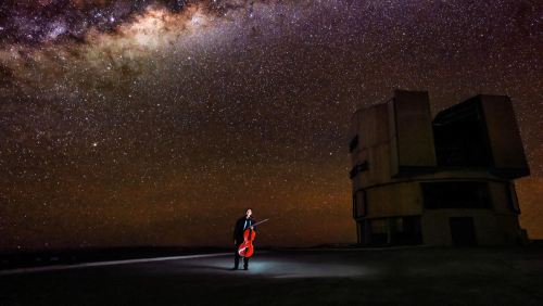 under a vivid night sky, yo-yo ma holds his cello near the observatories of Chile's Atacama Desert