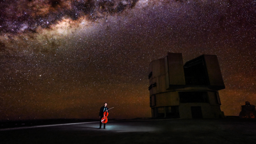 under a vivid night sky, yo-yo ma holds his cello near the observatories of Chile's Atacama Desert