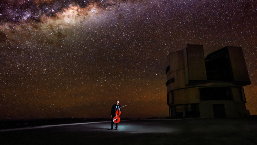 under a vivid night sky, yo-yo ma holds his cello near the observatories of Chile's Atacama Desert