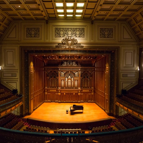 A picture of empty Jordan Hall with piano on stage
