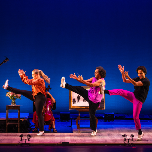 Music from the Sole in a performance photo, clapping and kicking