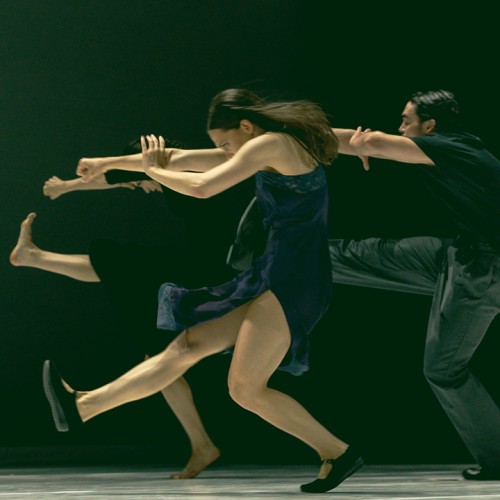 ballet bc, in performance, all dancers hunched forward, one leg kicked out