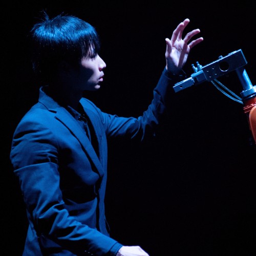Huang Yi dancer performing with KUKA robotic arm