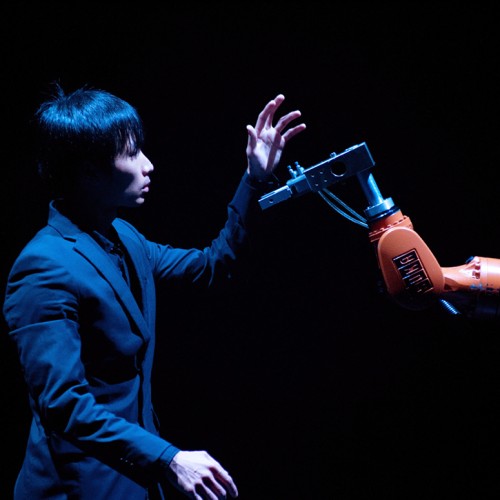 dancer huang yi and robot arm kuka, performance photo