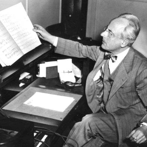 Aaron Richmond seated at piano desk