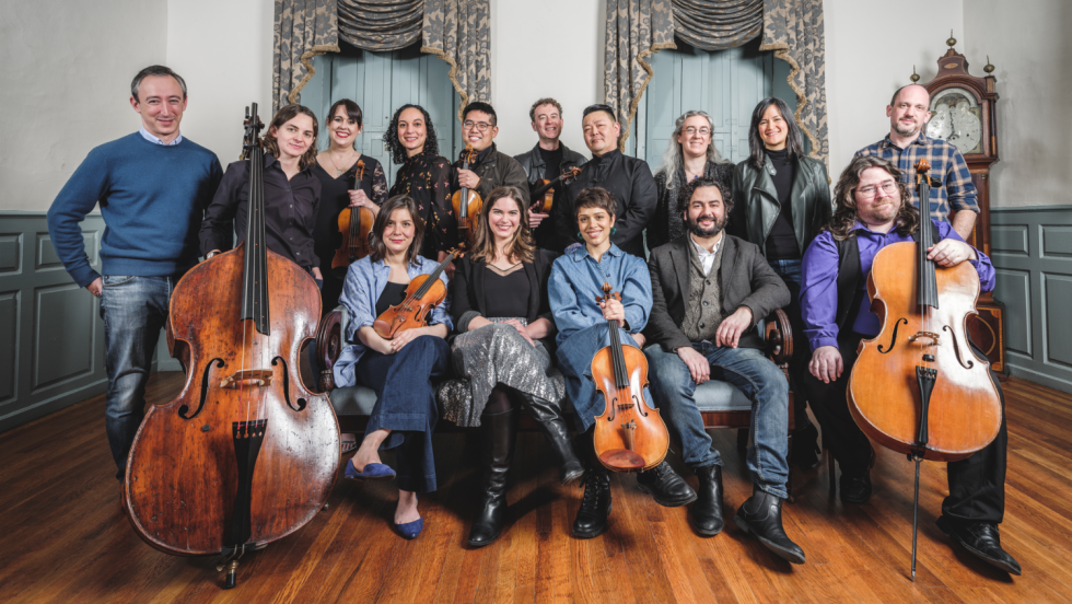 chamber orchestra sits in a stately historic building