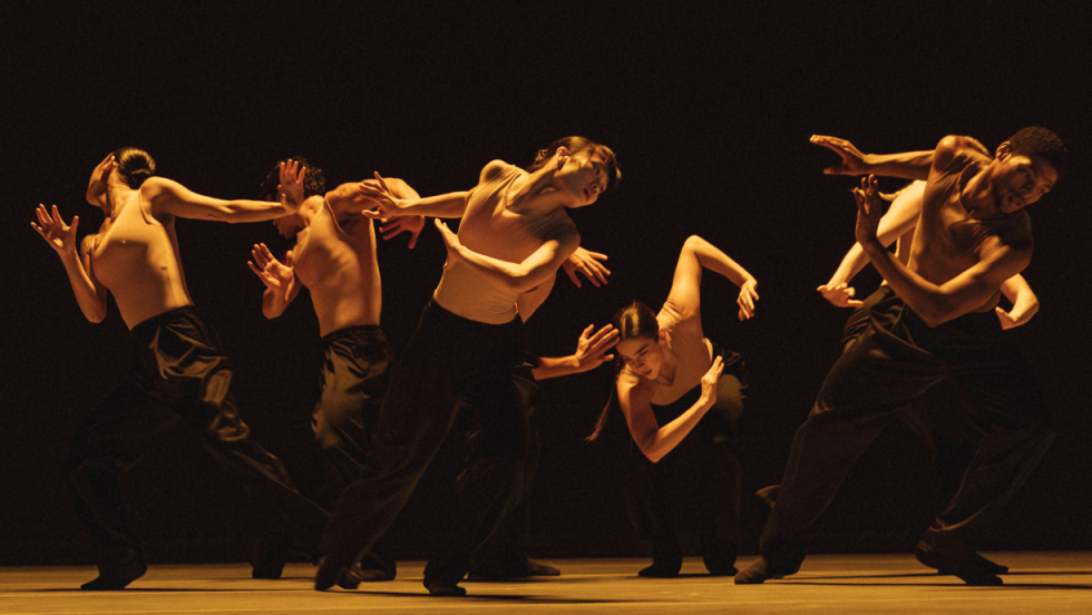 ballet bc in performance, arms whirling and bodies driving away from each other