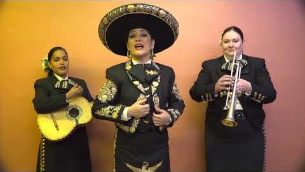 a trio of mariachi musicians performs in a studio