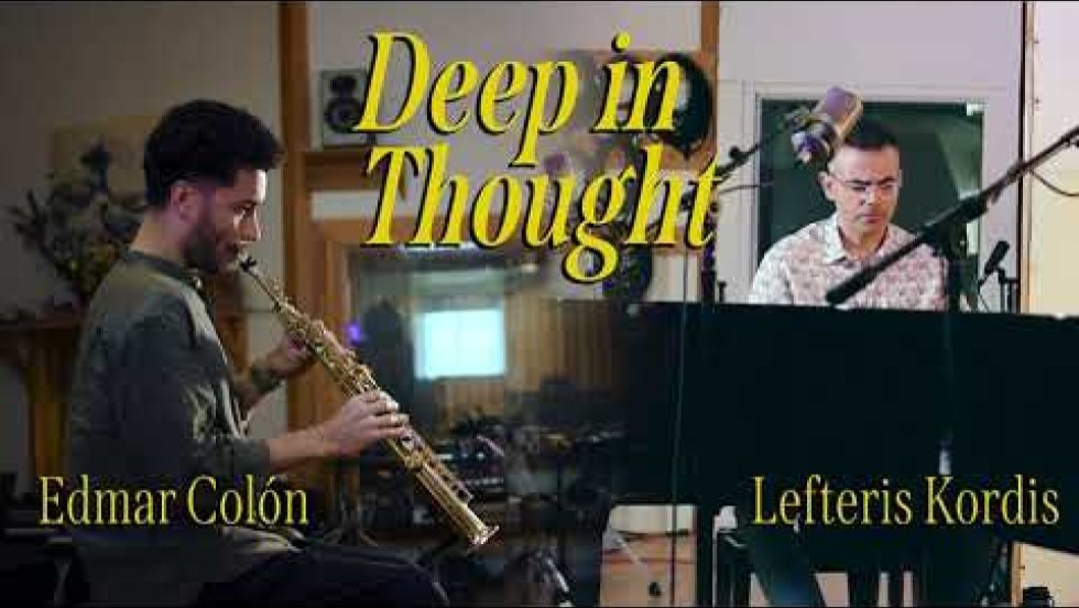 a saxophone player and a pianist perform in a recording studio