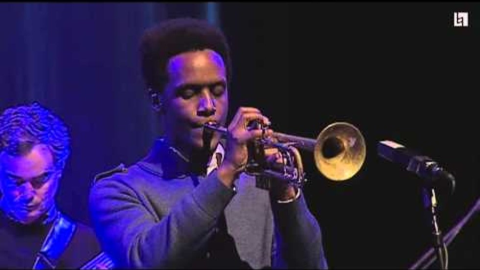 a jazz band performs in a large performance center