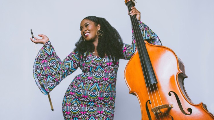 bassist endea owens, studio portrait with bass
