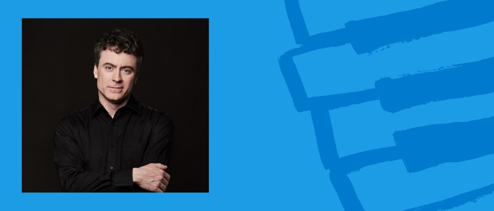 Paul Lewis, in black with his arms folded across his chest, in an inset photo against a blue piano key drawing