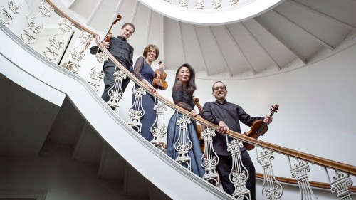 Brentano String Quartet, group photo on curved staircase