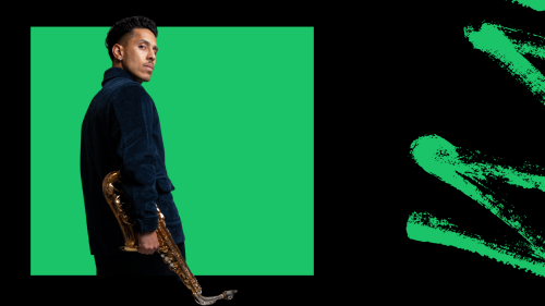 Jonathan Suazo, turned away, holds his saxophone